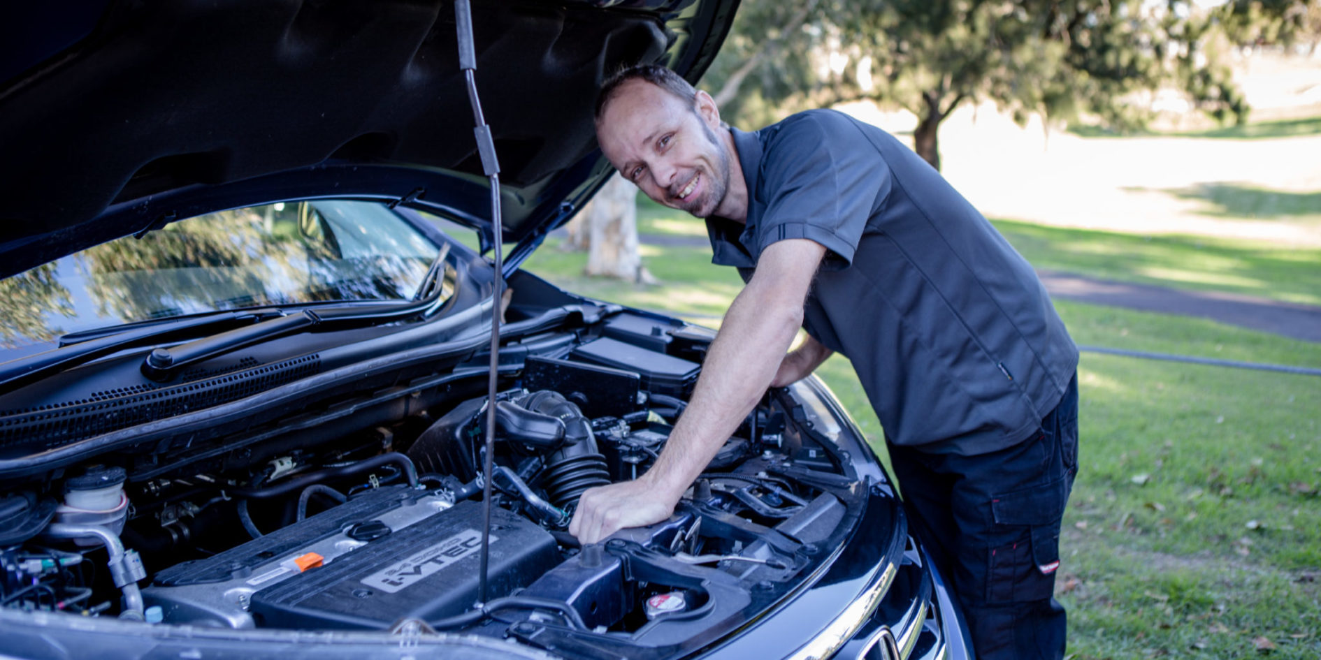 Nev Thomas of Thomas Mechanical inspecting an automotive engine